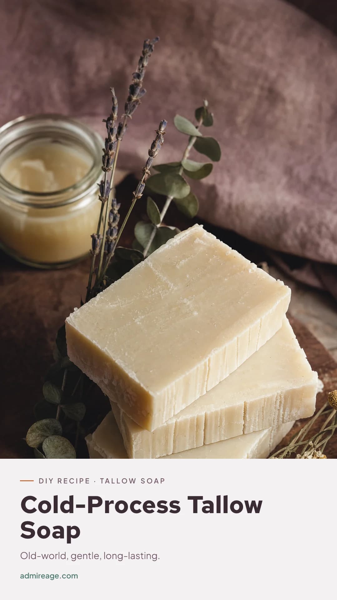 Hand-cut bars of creamy pale tallow soap curing on a wooden rack.