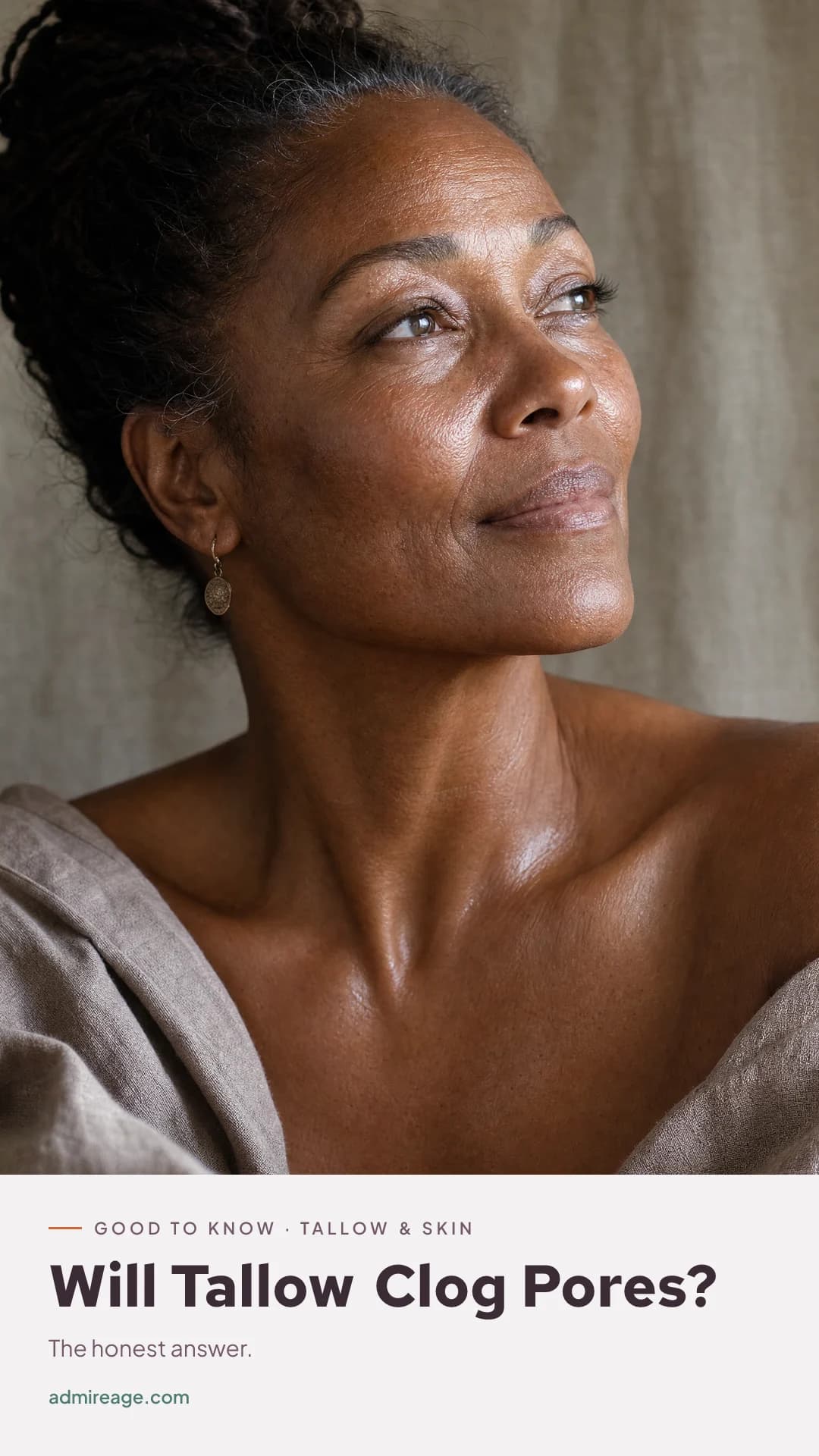 Close-up of calm, clear mature skin after moisturizing.
