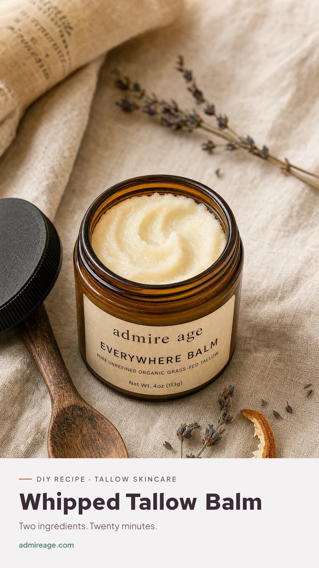 A jar of softly whipped, cushiony tallow balm on a linen surface.