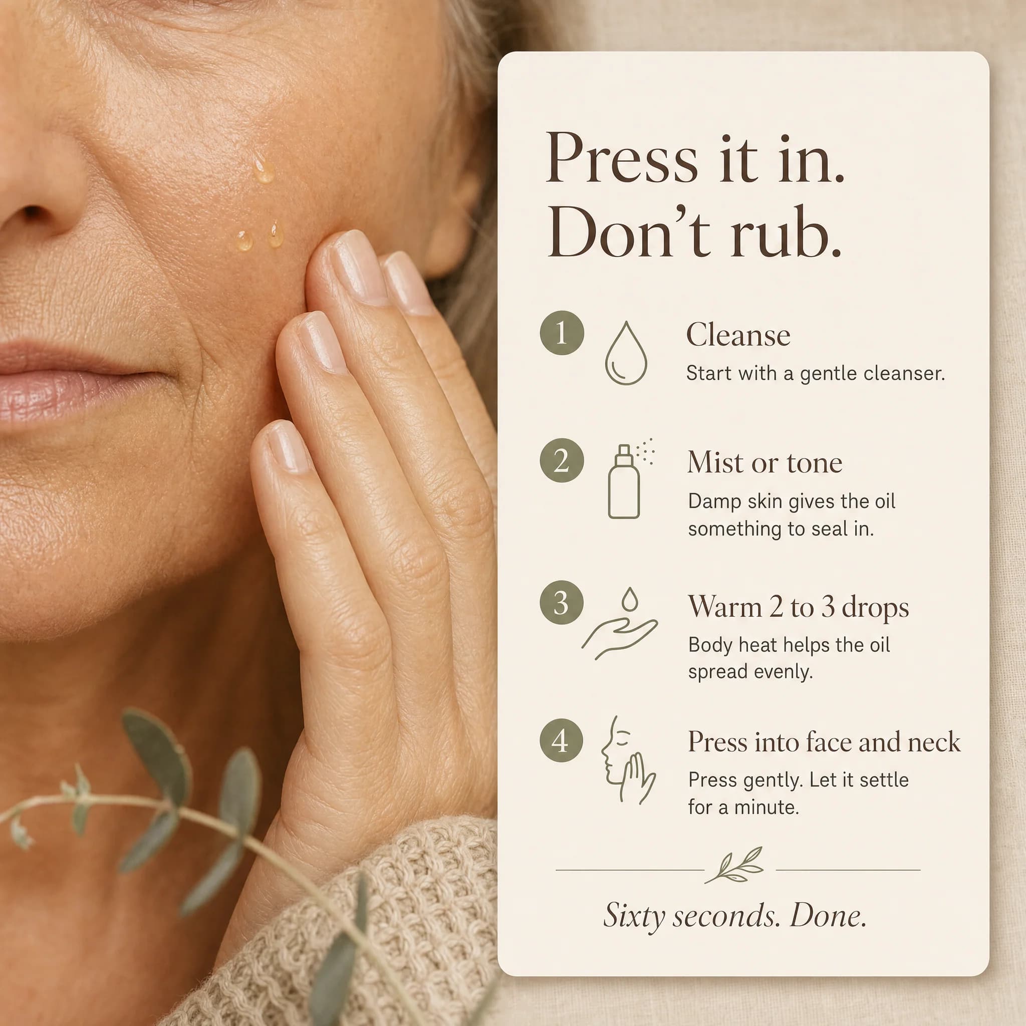 Close-up of a mature woman gently pressing pale-gold oil drops into her cheek, with a card to the right titled 'Press it in. Don't rub.' showing the four-step method: cleanse, mist or tone, warm 2 to 3 drops, and press into face and neck