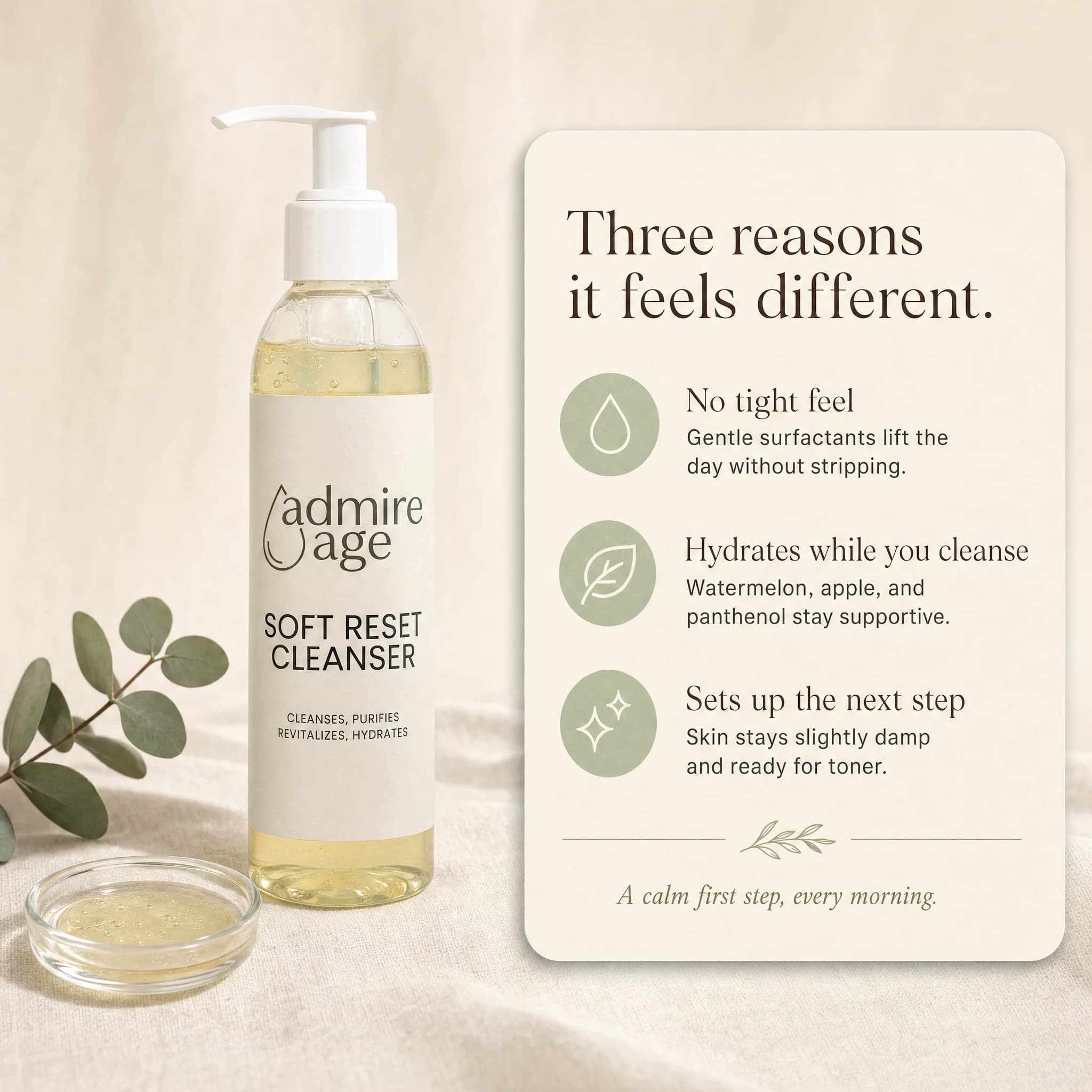 Soft Reset Cleanser bottle on cream linen beside a small clear-glass dish of pale-gold gel and a eucalyptus sprig, with an ivory card to the right titled 'Three reasons it feels different' listing No tight feel, Hydrates while you cleanse, and Sets up the next step
