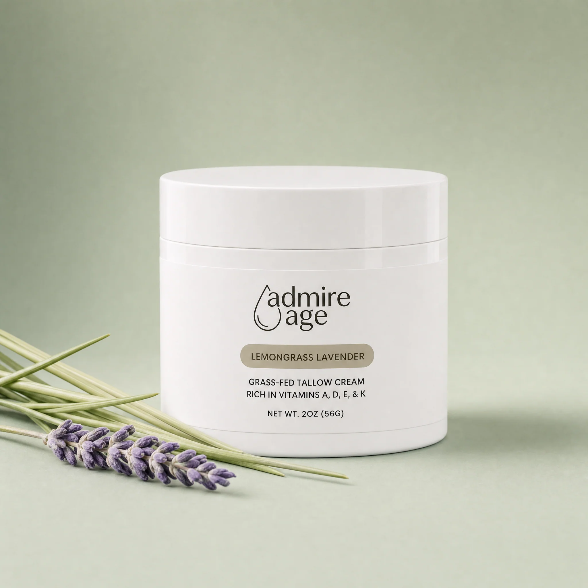 Admire Age Lemongrass Lavender tallow cream jar on a soft sage-green background with lemongrass and lavender